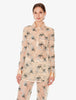 Woman wearing a floral pajama set on a white background