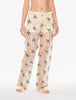 Floral-patterned pajama pants worn by a person on a white background