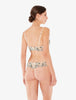 Woman wearing a floral lingerie set on a white background