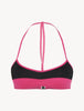 ACTIVE BEACH Color-block bikini top in fuchsia and black.