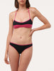 ACTIVE BEACH Color-block bikini top in fuchsia and black.
