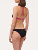 ACTIVE BEACH Color-block bikini top in fuchsia and black.